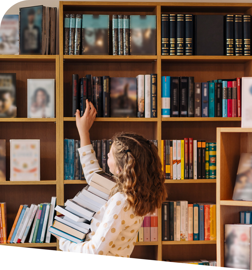 Author selecting books in a library